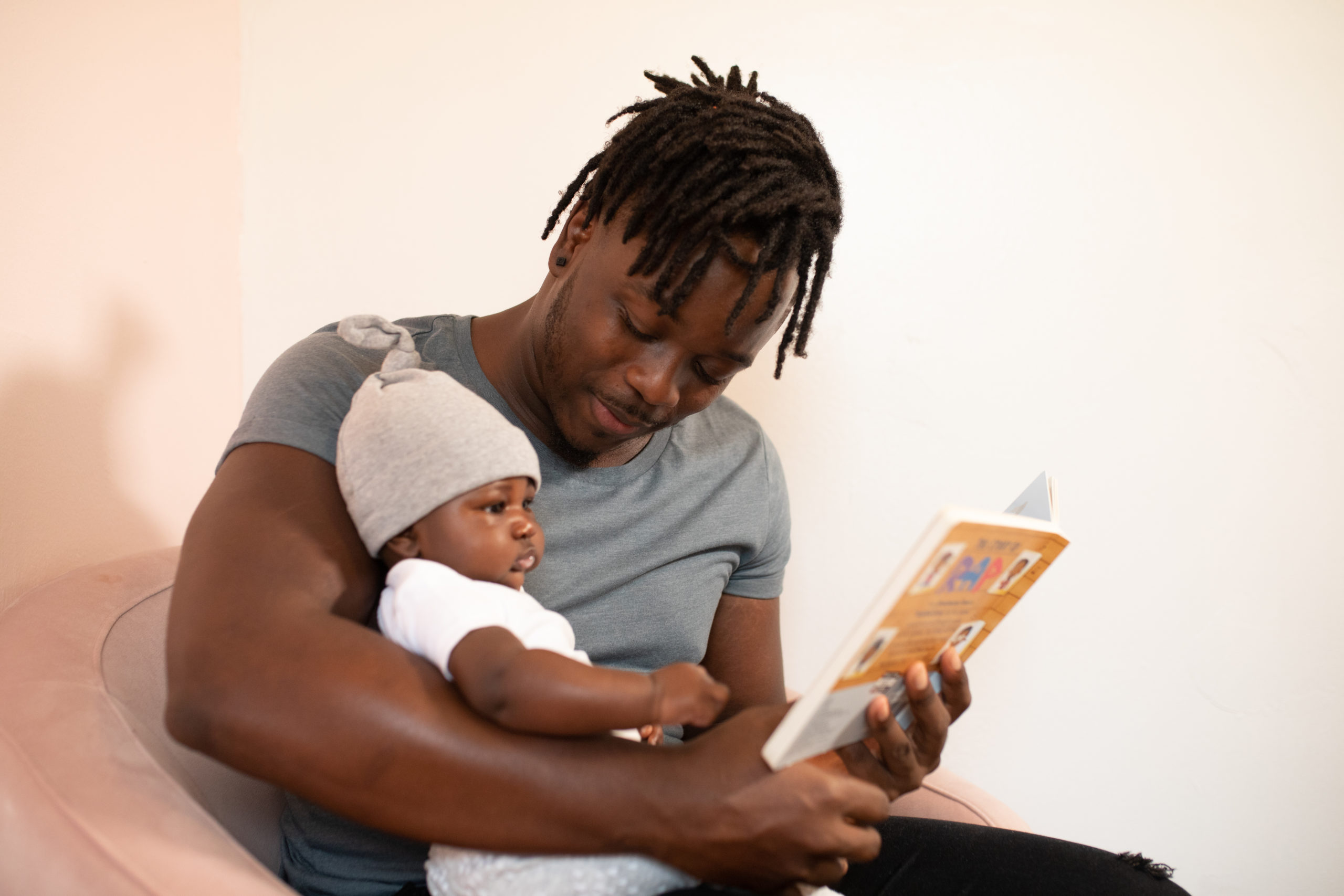 Man Reading to Baby